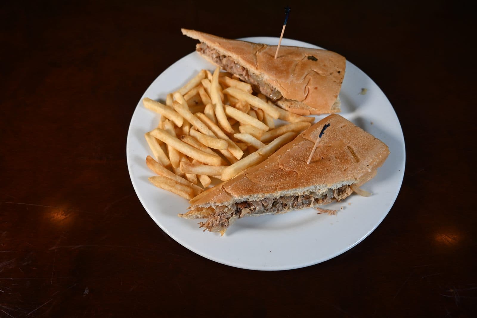 Cuban Sandwich pressed on Cuban bread served with french fries